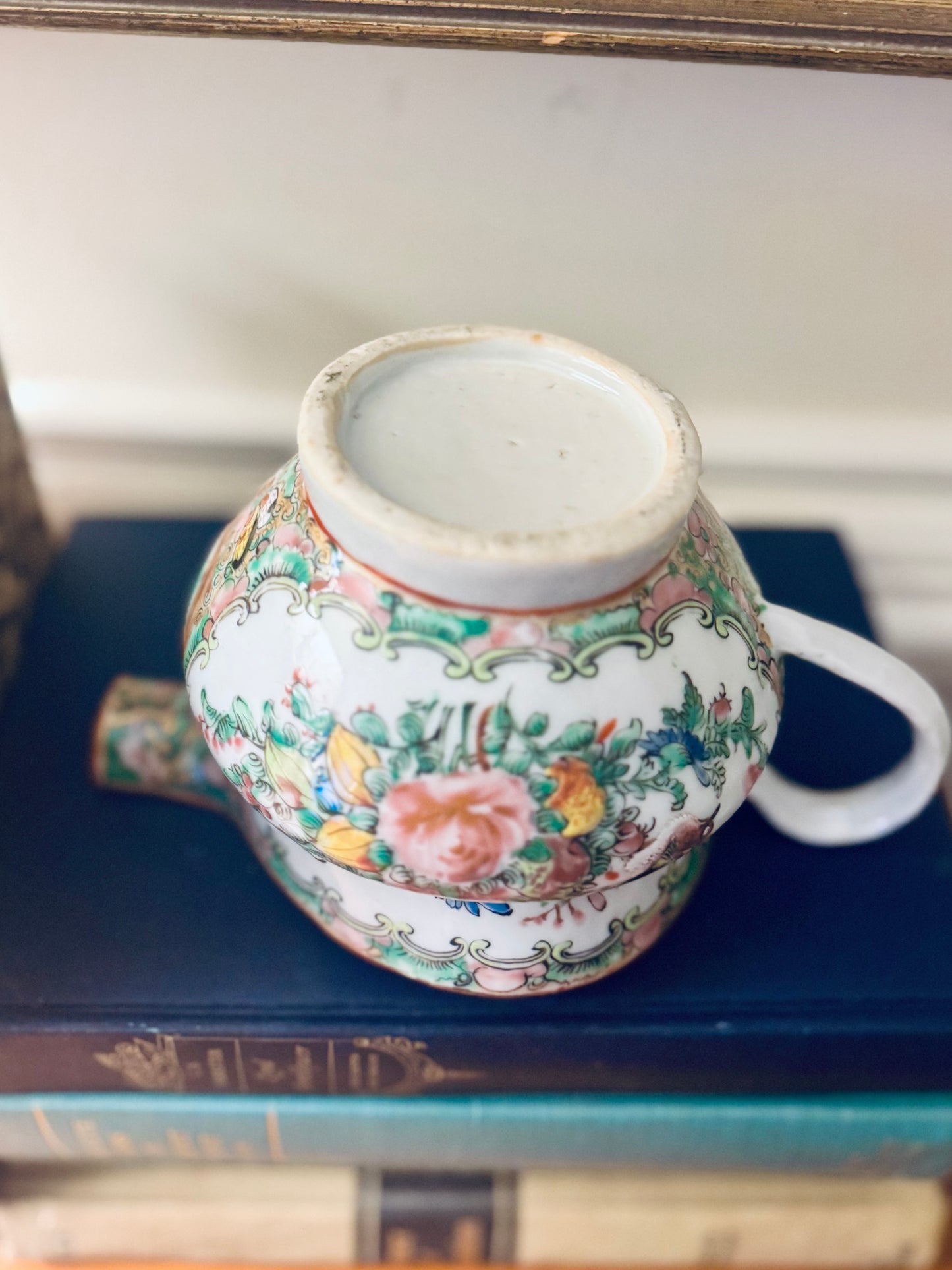 Decorative ceramic vase with floral patterns on a blue surface