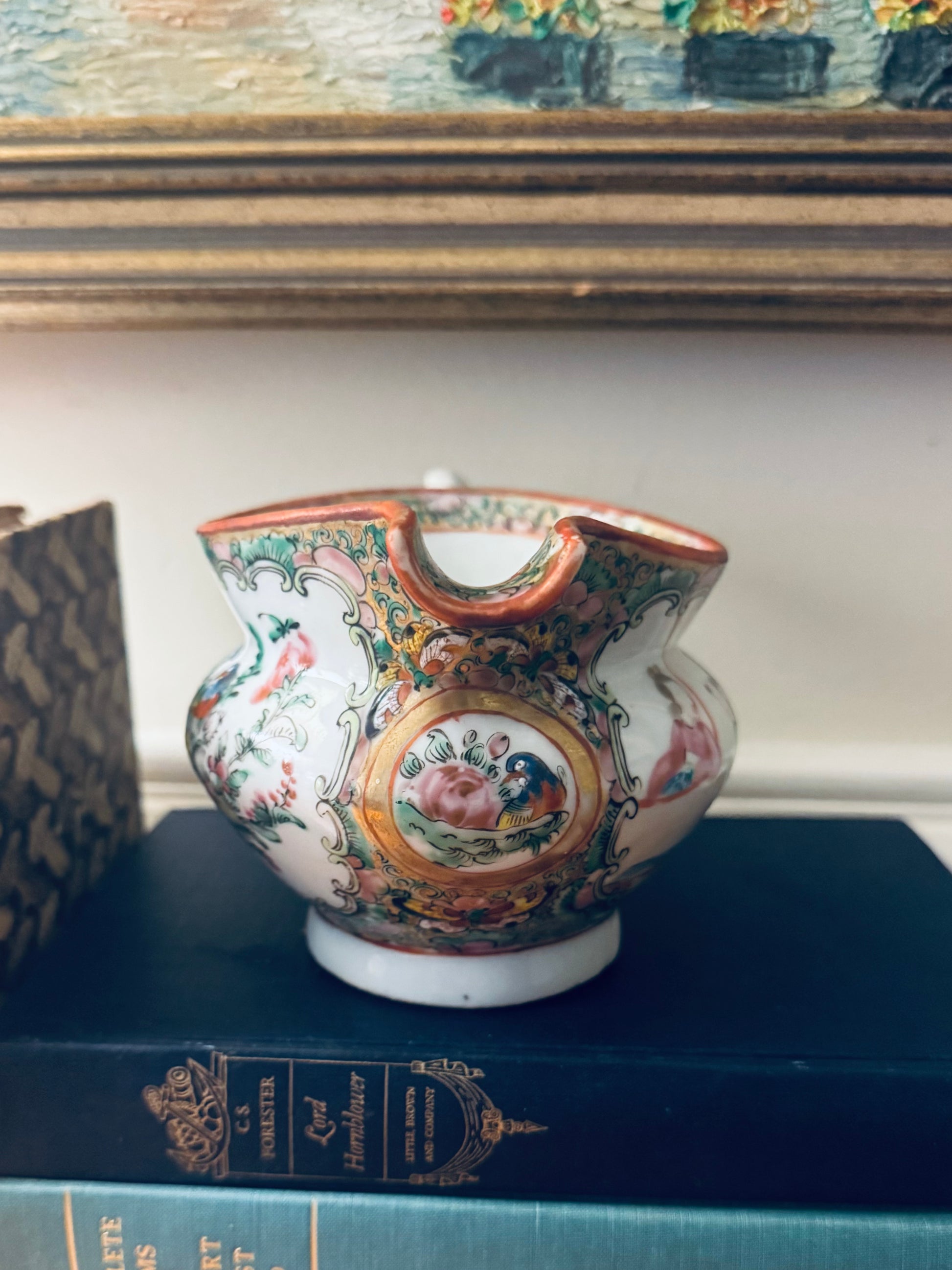 Decorative ceramic vase with intricate designs on a blue surface