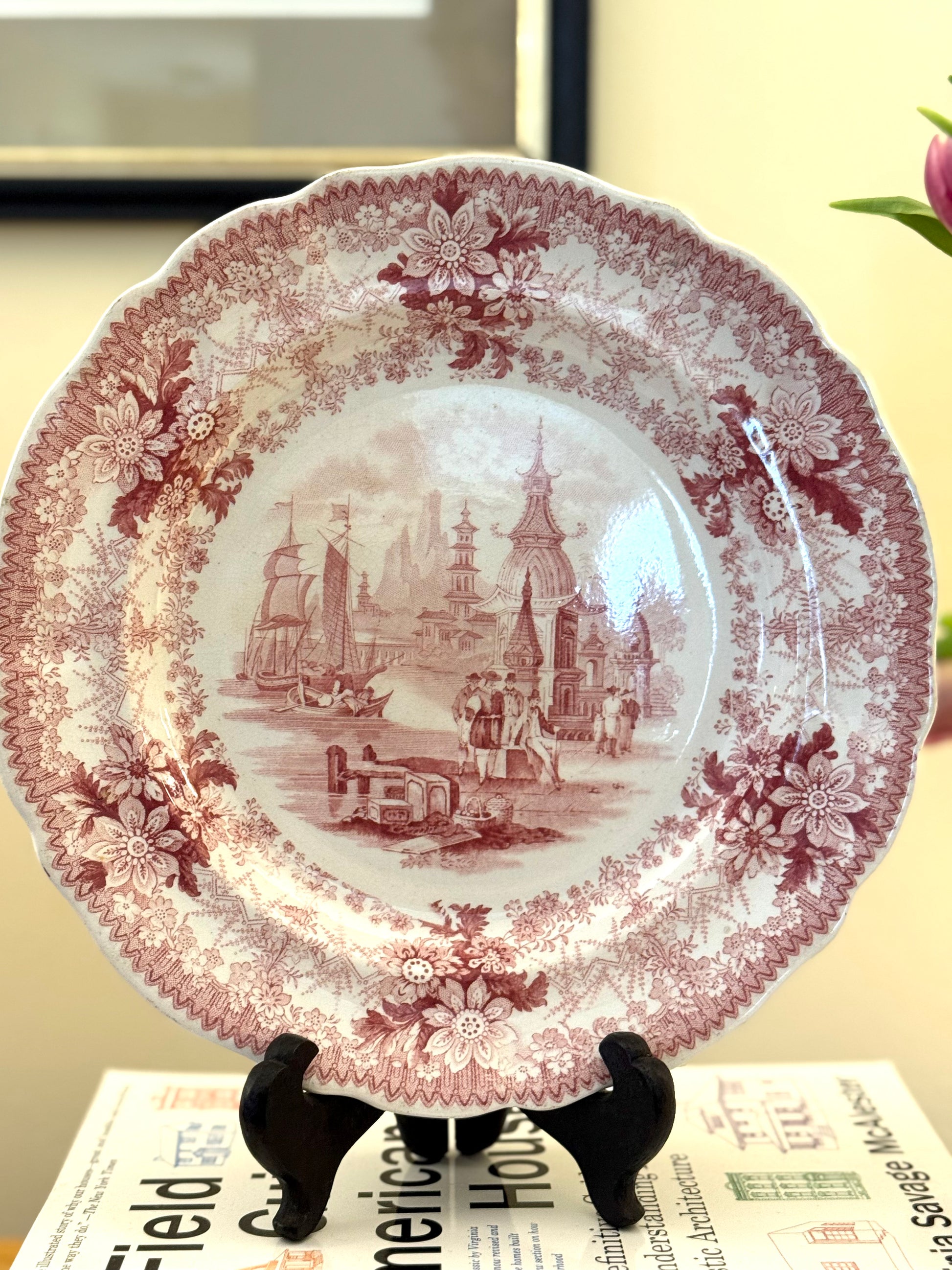 Decorative plate with vintage design on a stand