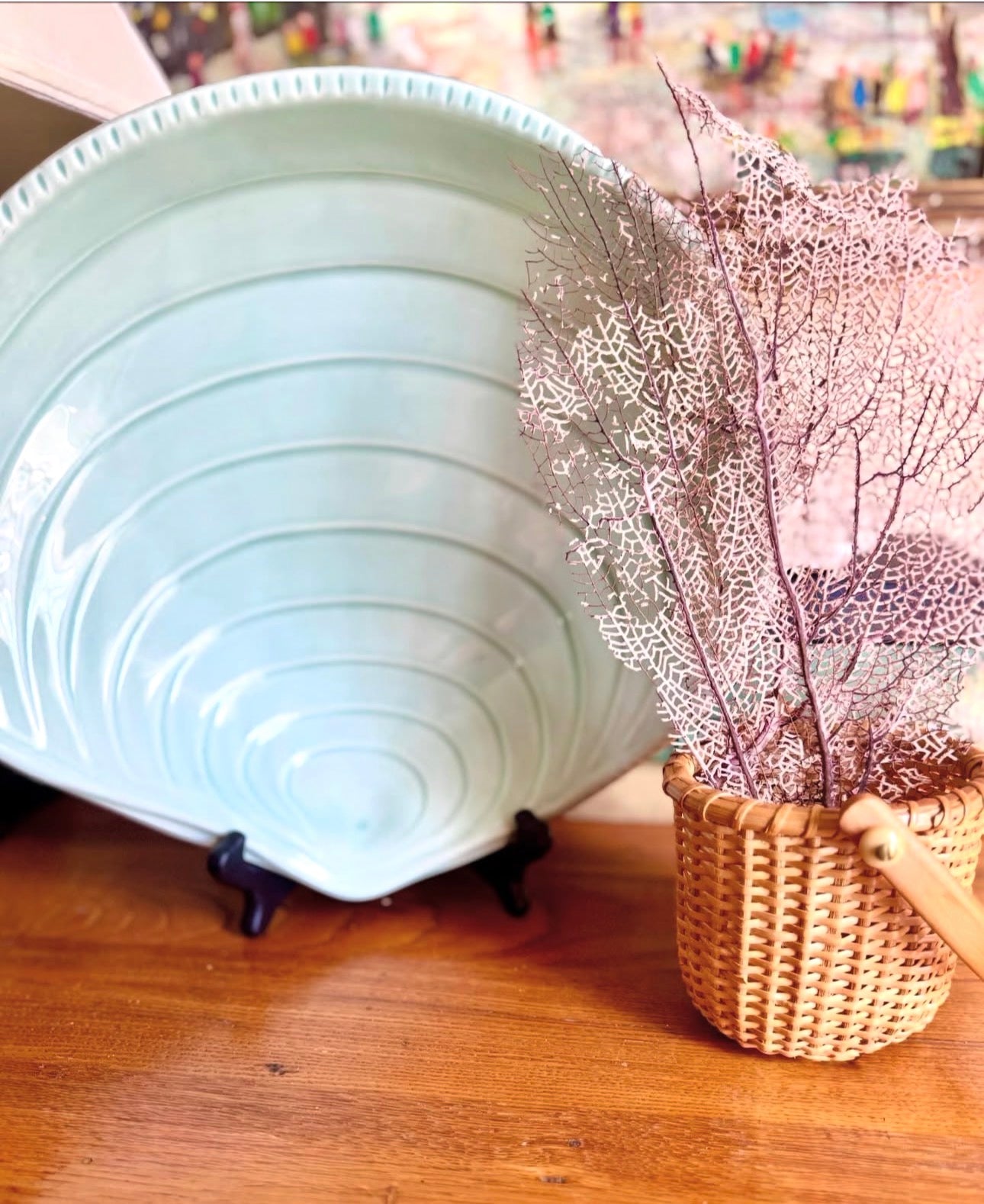 Blue serving dish with basket beside it.